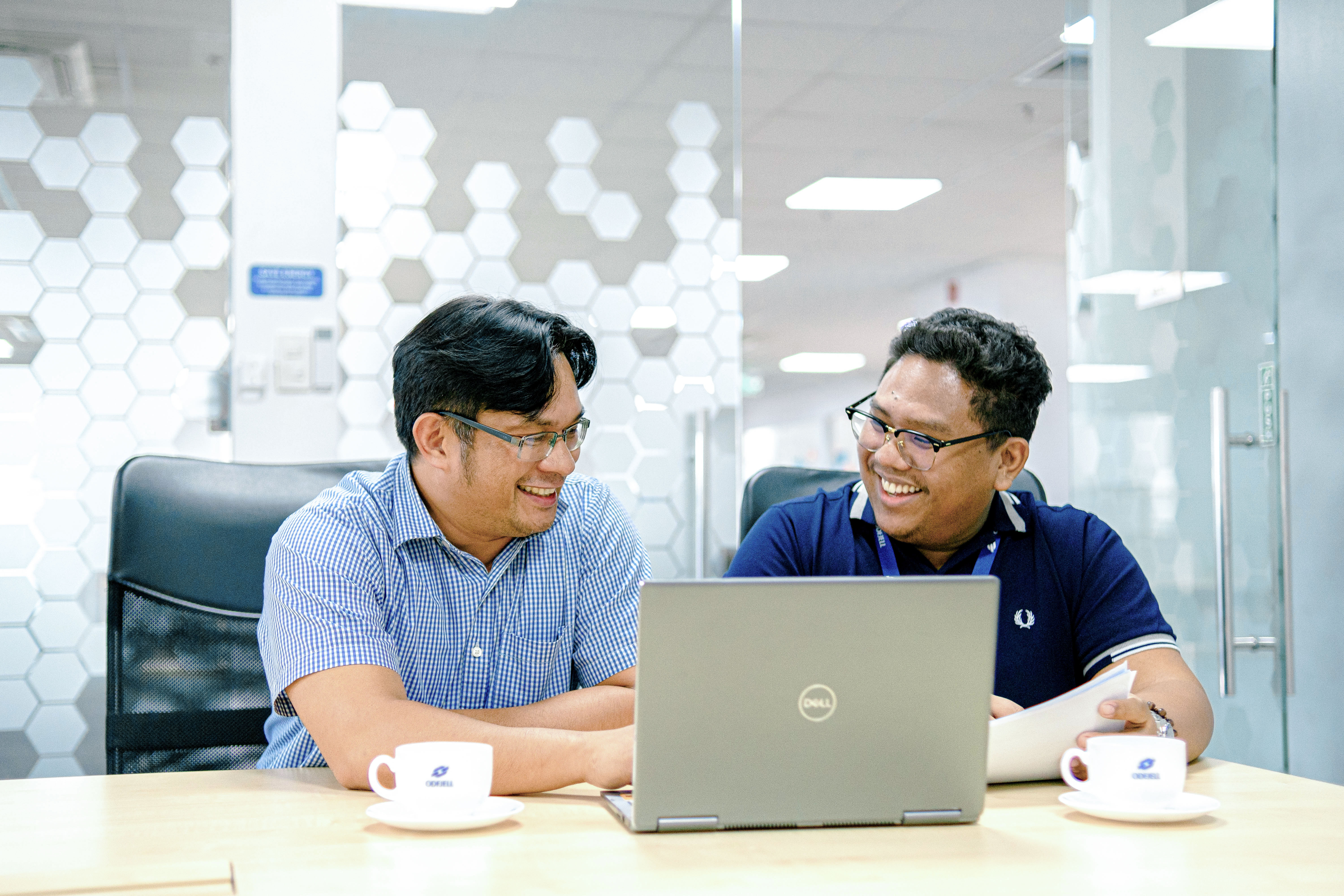 Odfjell Manila office team in a meeting with presentation displayed on screen.