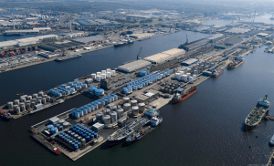 Aerial view of Odfjell’s Noord Natie terminal in Antwerp with chemical storage tanks and tankers docked along the quay.